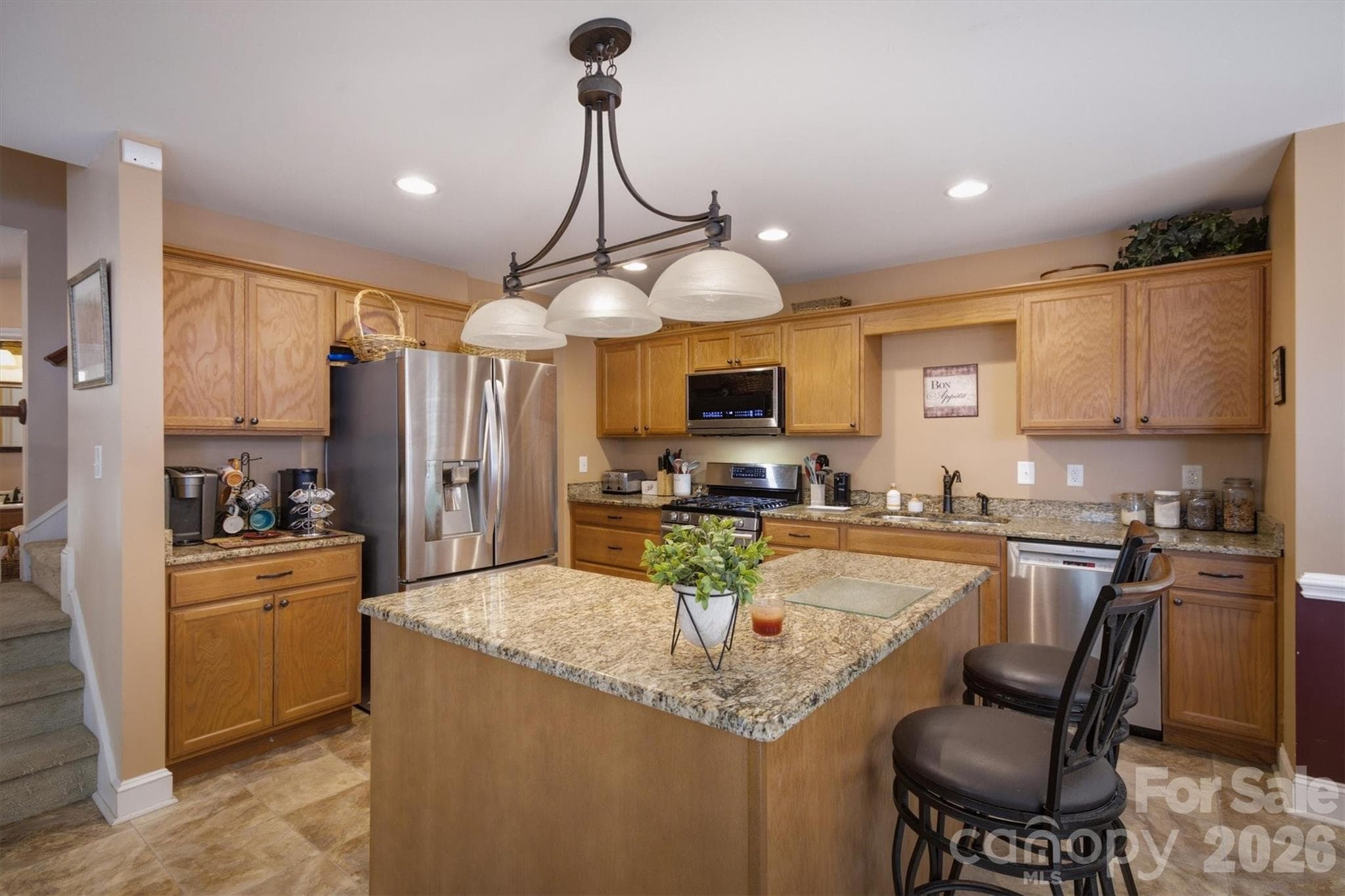 Kitchen/ with graniteisland and lots of light - 802 White Oaks Circle, Monroe