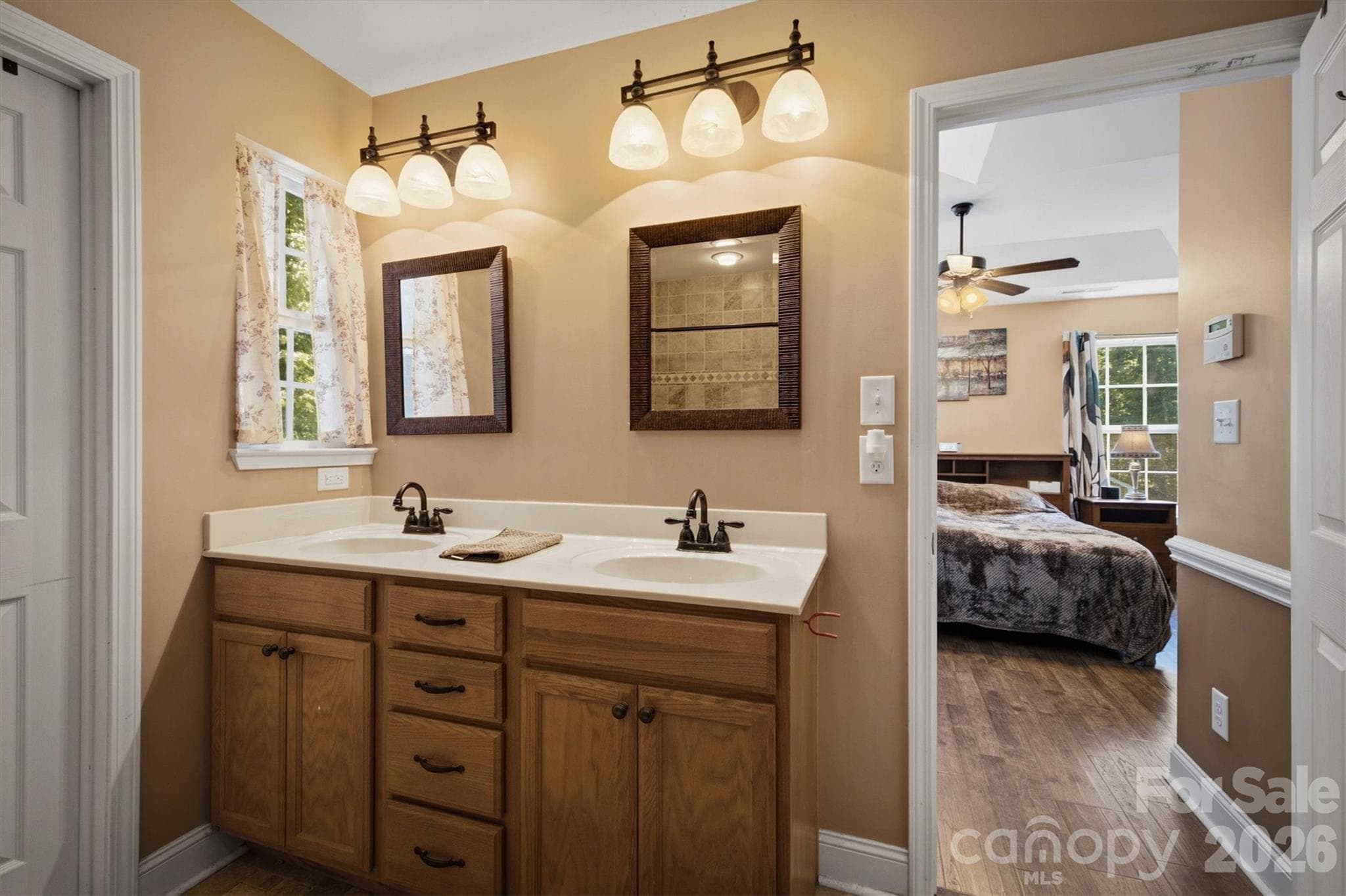 Primary bath with double vanity - 802 White Oaks Circle, Monroe