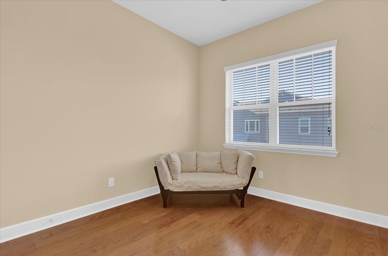 Bright secondary bedroom offering comfortable space and natural light. - 9219 LAUREATE BLVD, ORLANDO