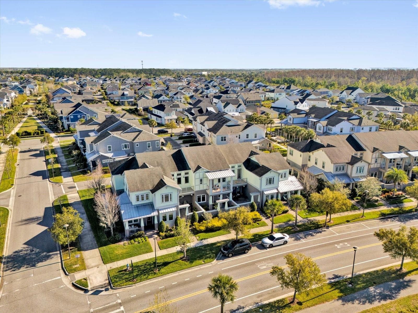 Bird's-eye view of the vibrant, tree-lined Laureate Park community. - 9219 LAUREATE BLVD, ORLANDO
