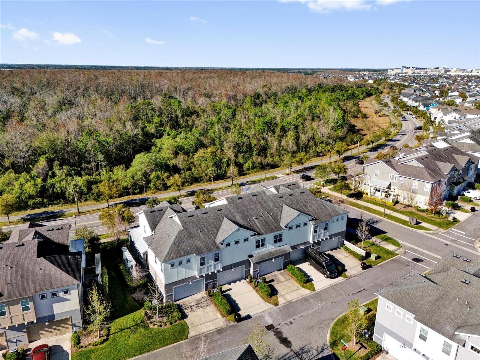 Sweeping aerial view of Lake Nona's lush, master-planned surroundings. - 9219 LAUREATE BLVD, ORLANDO