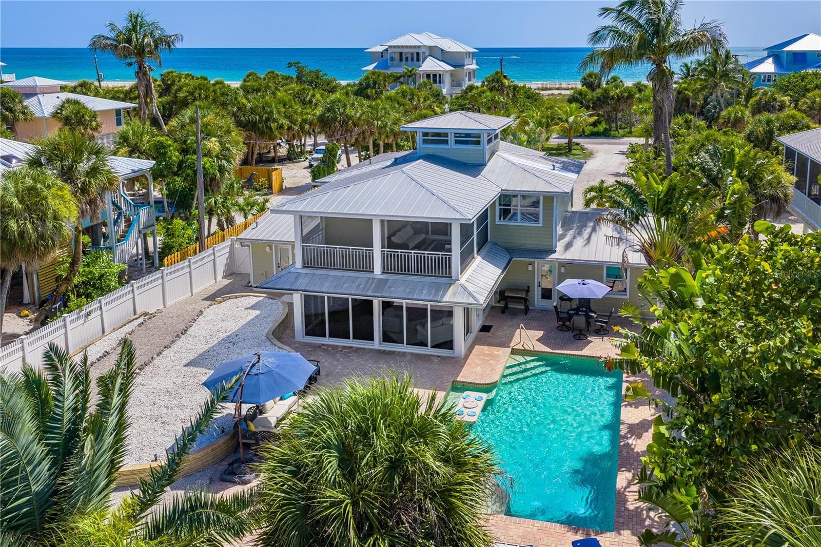 Double lot privacy, yet steps to the azure waters of The Gulf and miles of peaceful, quiet beach. - 550 N GULF BLVD, PLACIDA