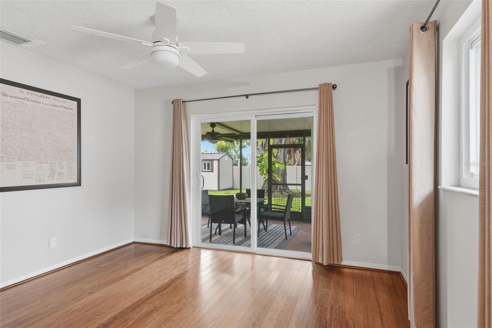 Primary Bedroom with entry to screened in back porch and yard - 205 SE MONROE CIR N, ST PETERSBURG