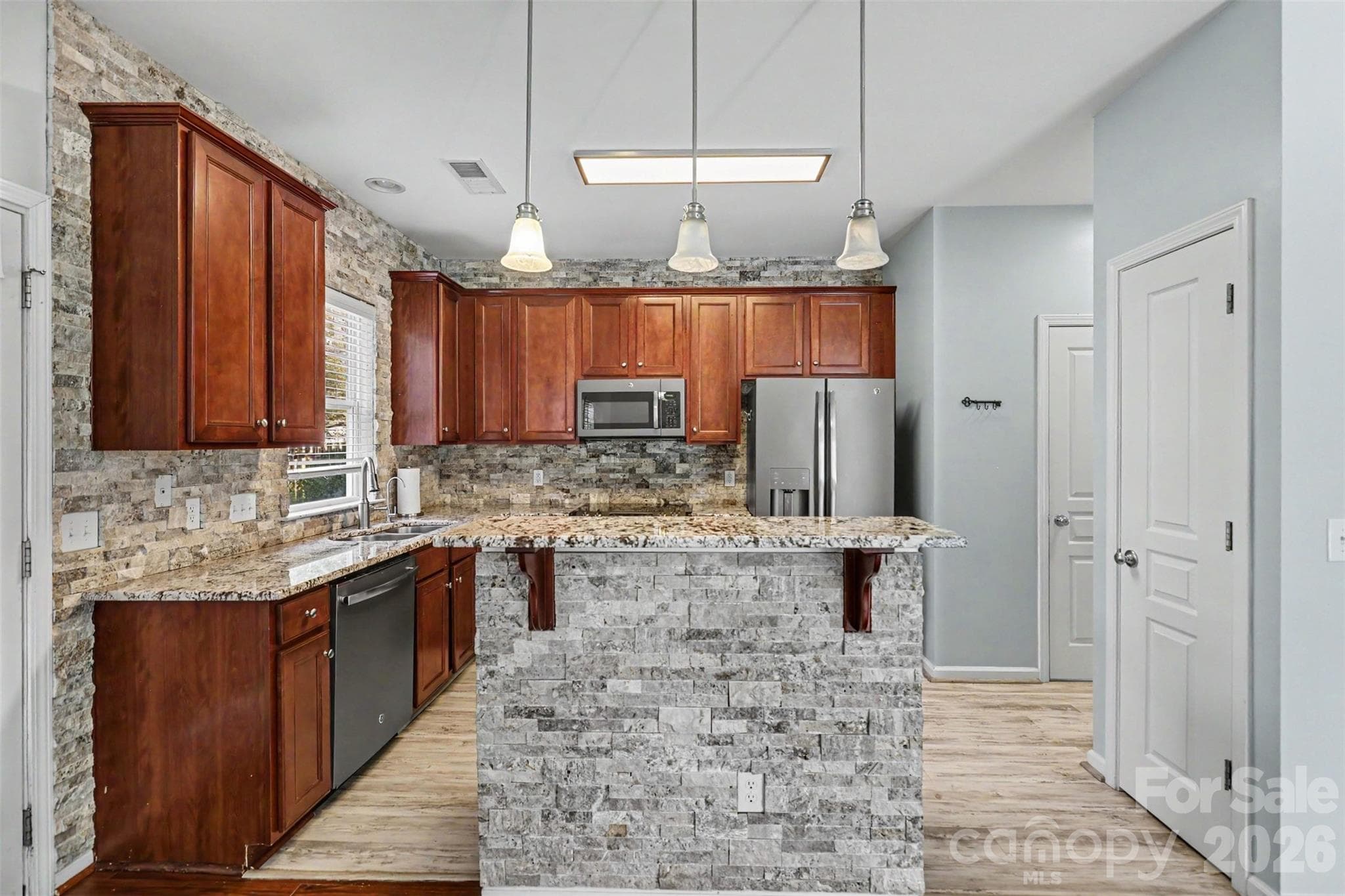 Functional kitchen with beautiful stone accents - 712 Tulip Tree Place, Rock Hill