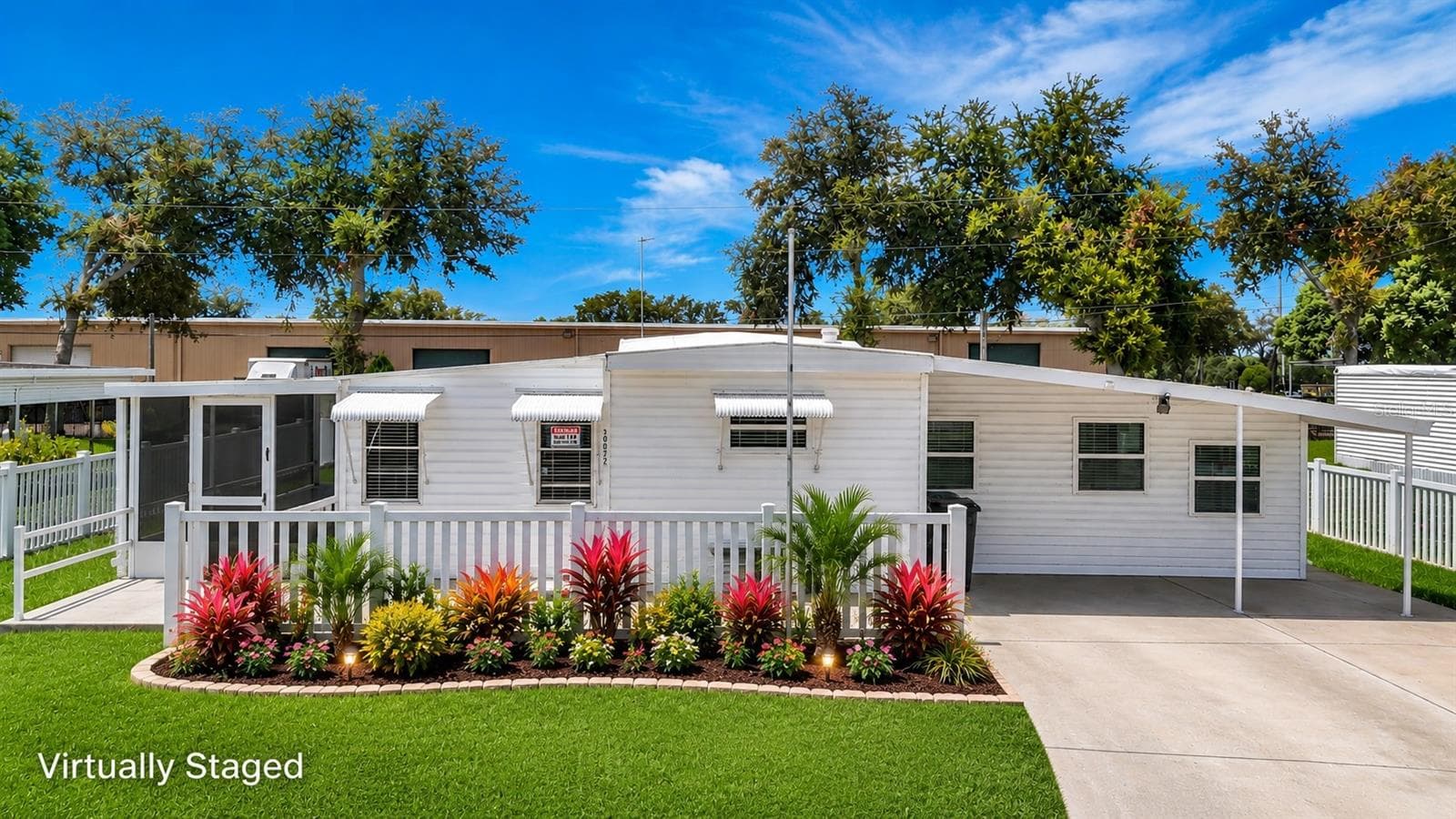 What home could look like if flower bed was redone. - 39032 OLA AVE, ZEPHYRHILLS