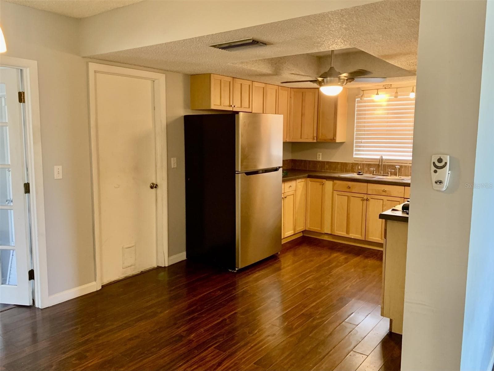 View of kitchen from dining room - 5050 29TH AVE N, ST PETERSBURG