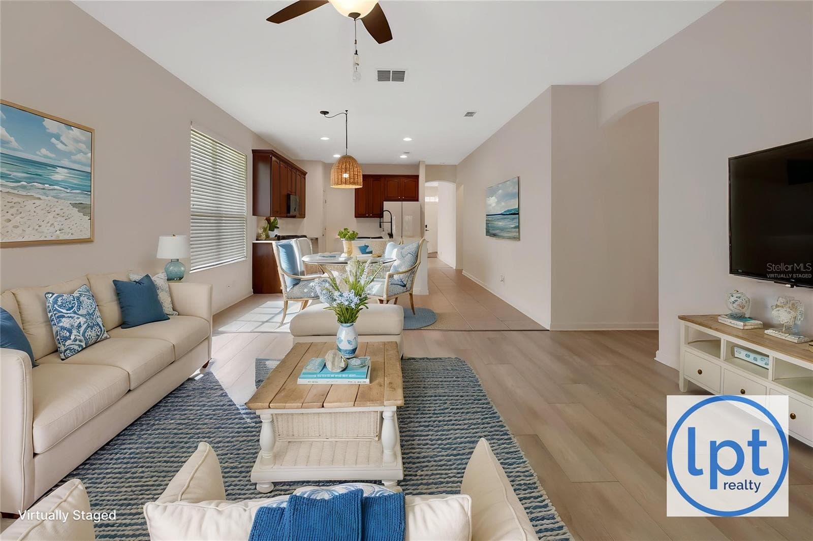 Virtually Staged family room into kitchen - 525 HERON POINT WAY, DELAND