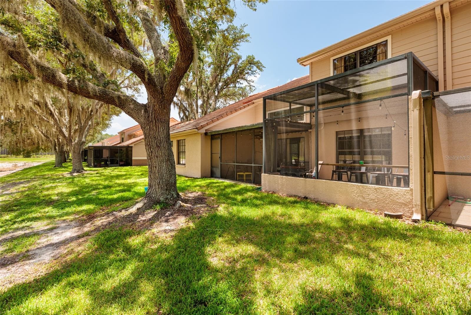 view from lake to unit - 17557 FAIRMEADOW DR, TAMPA