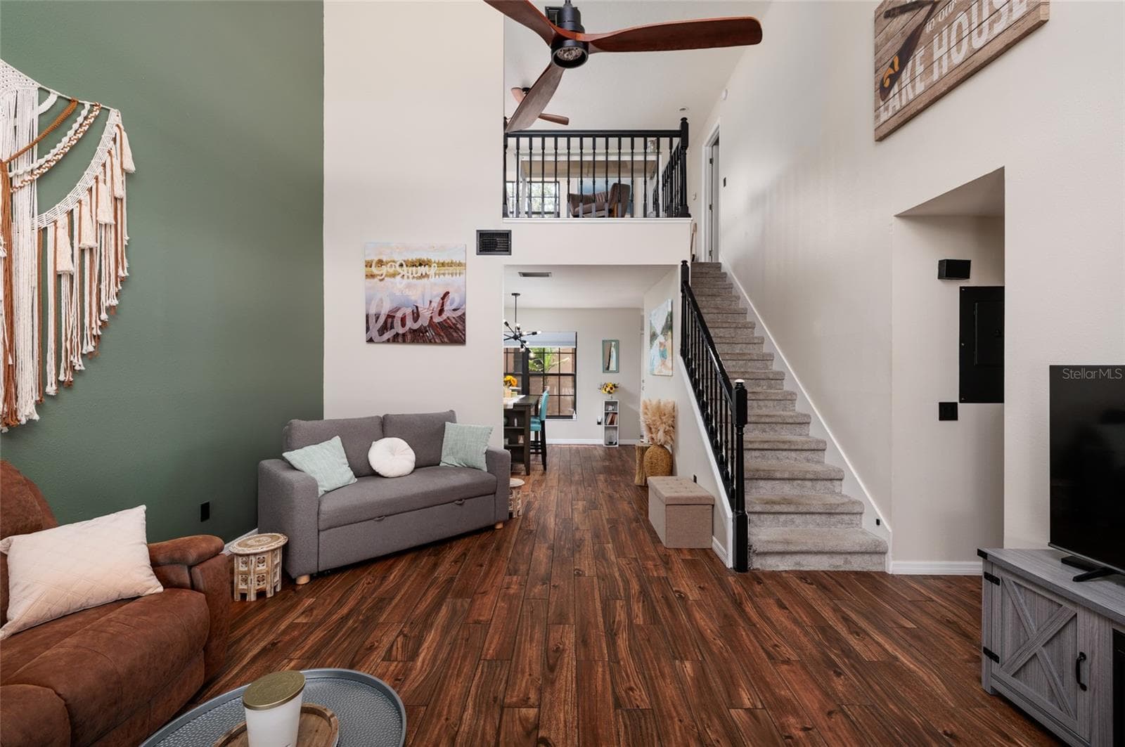 living room with stairs to second floor - 17557 FAIRMEADOW DR, TAMPA
