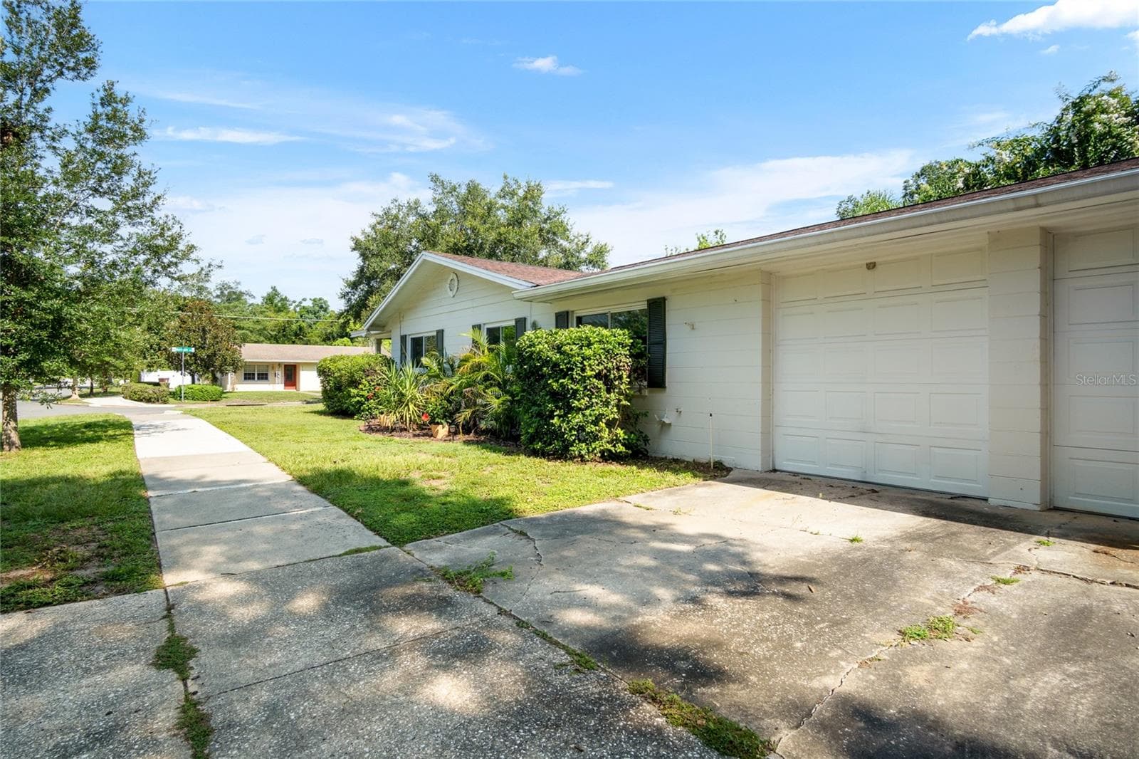A 2-car garage is located on the side of the home. - 501 MERIDALE AVE, ORLANDO