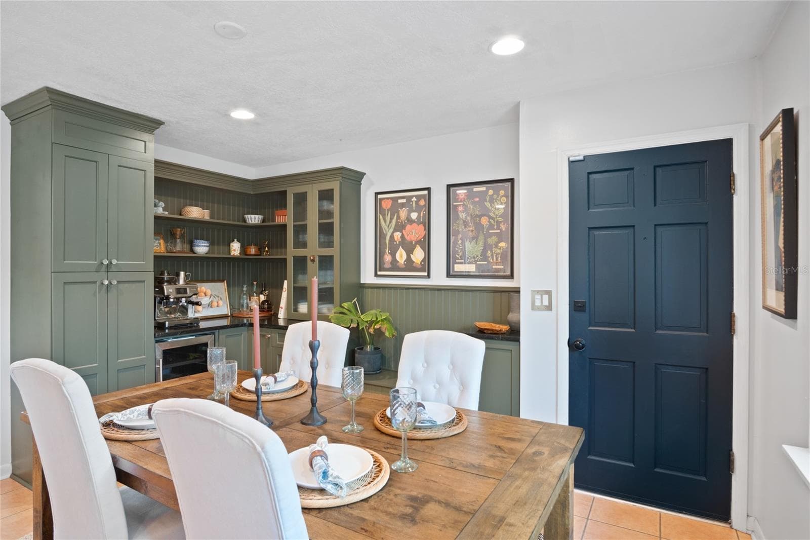 A view of the dining room and coffee bar with wine refrigerator. - 501 MERIDALE AVE, ORLANDO
