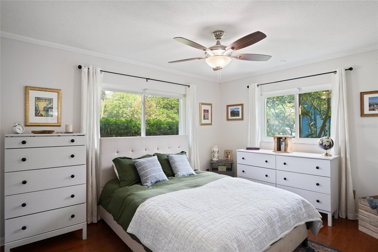 The primary bedroom is light and bright with windows looking out to the west and to the north. - 501 MERIDALE AVE, ORLANDO