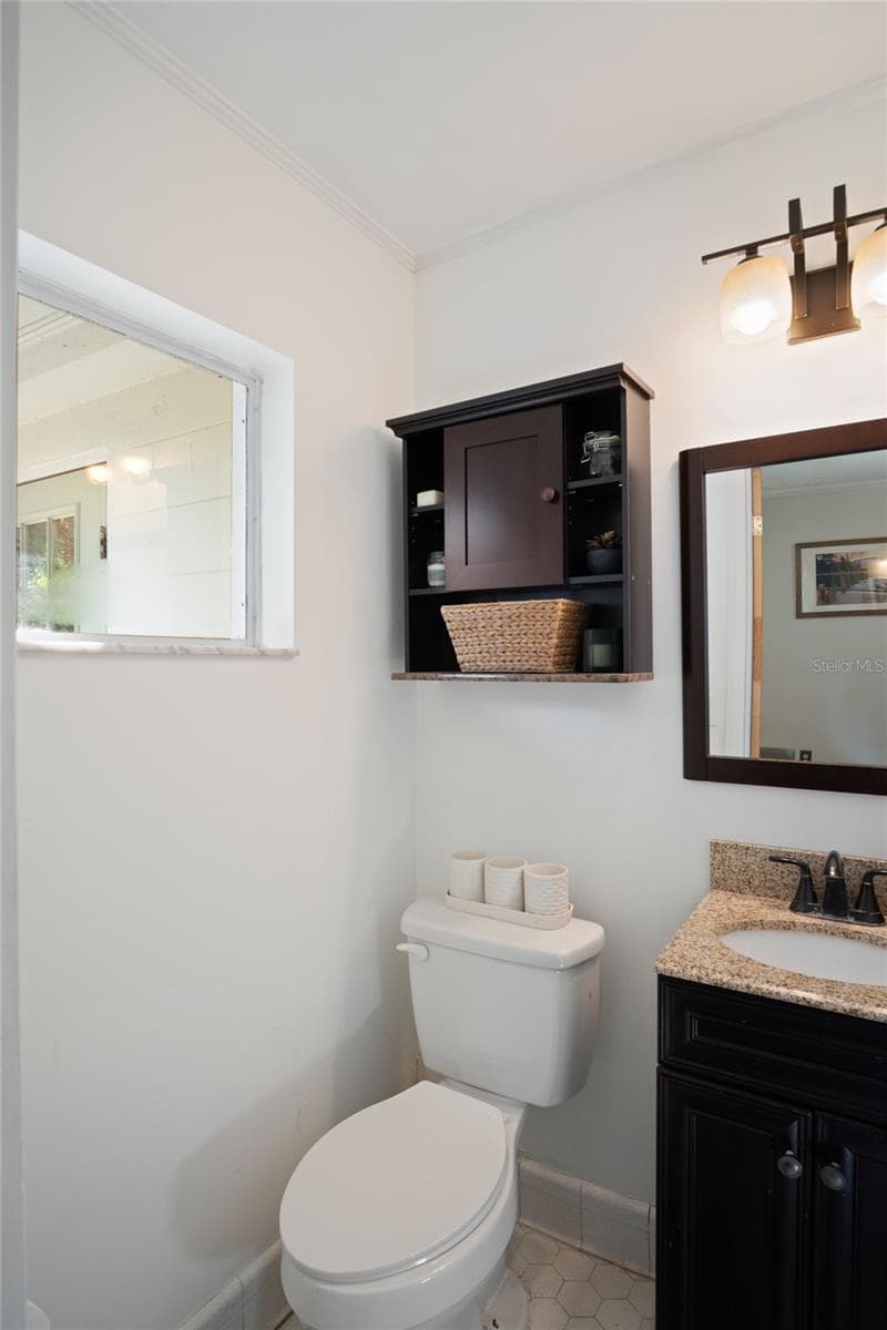 The half bath looks out to the back of the home. - 501 MERIDALE AVE, ORLANDO