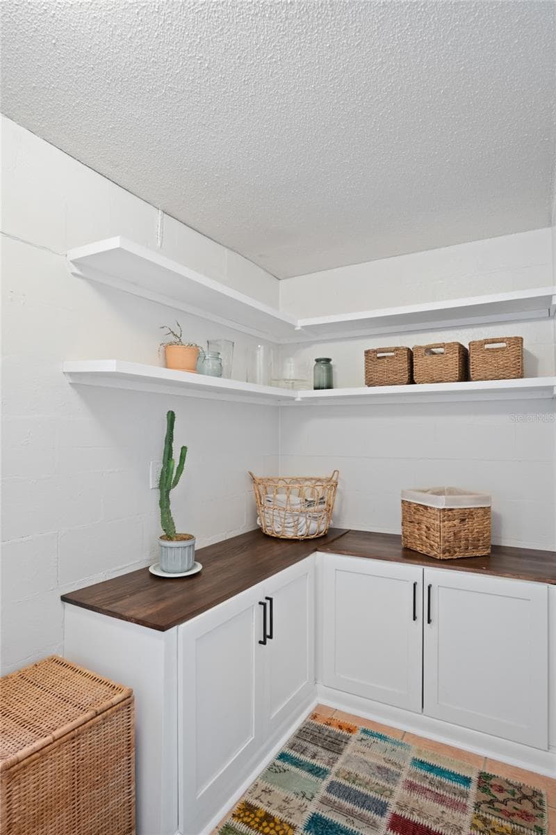 The laundry room has great storage and a work area. - 501 MERIDALE AVE, ORLANDO
