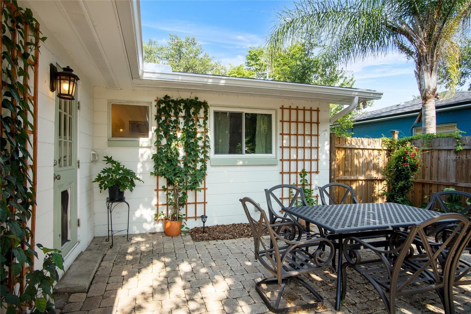 An inviting patio is a great place to have a meal or just relax under the crepe myrtle. - 501 MERIDALE AVE, ORLANDO