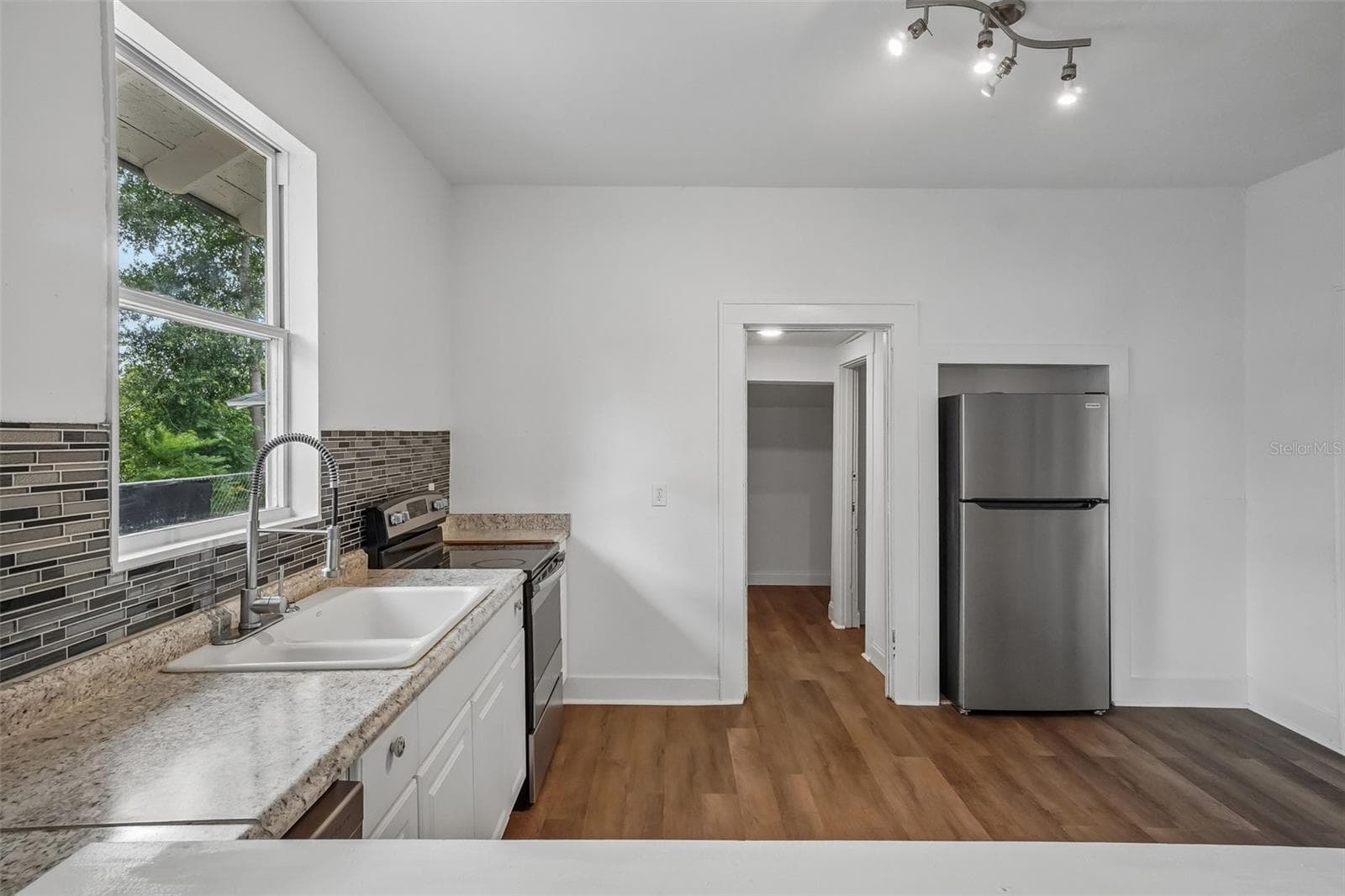 Kitchen - View from Viewing Window - 1533 E ELM RD, LAKELAND