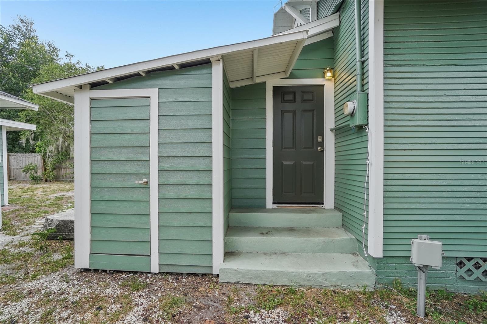 Main House Exterior- Side Door and Storage Closet - 1533 E ELM RD, LAKELAND