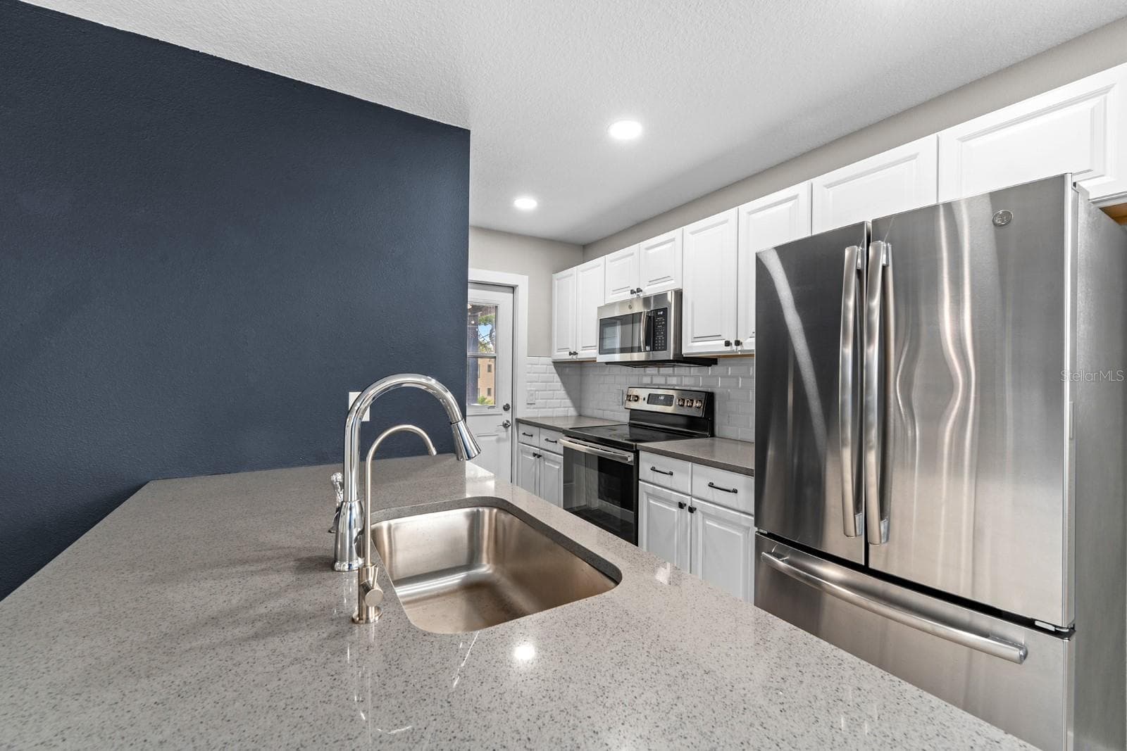 This guest suite is complete with a balcony, too - 1028 5TH ST N, ST PETERSBURG