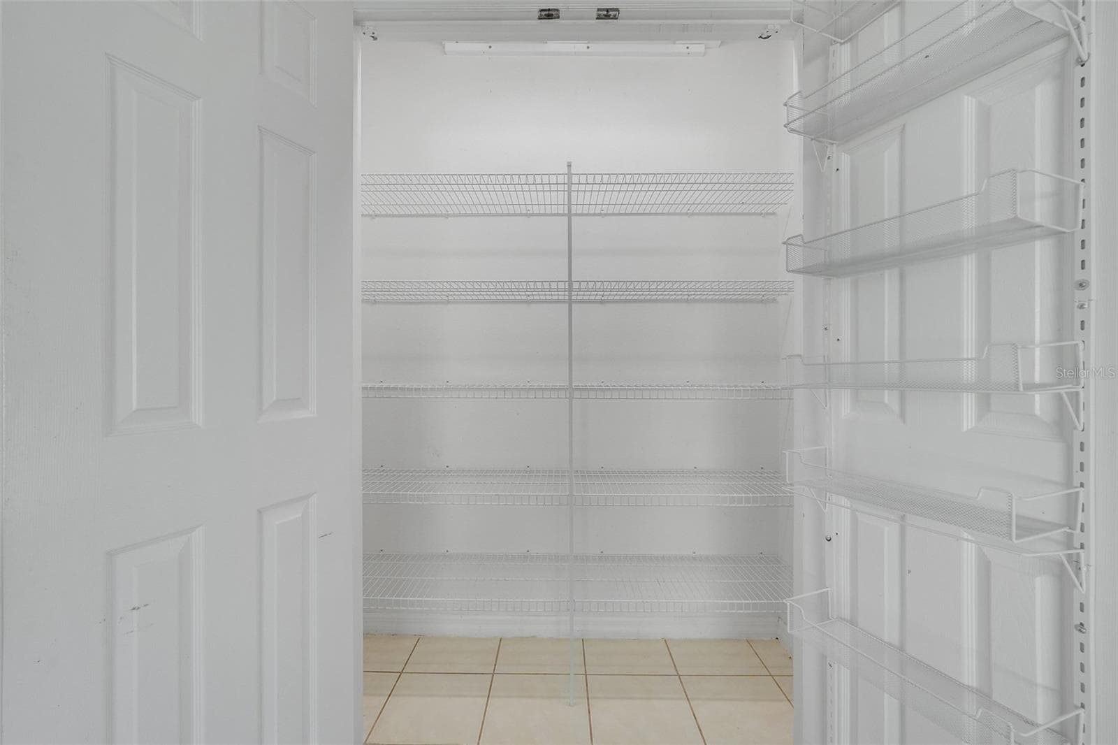 Pantry in kitchen with automatic lights - 16740 GLENBROOK BLVD, CLERMONT