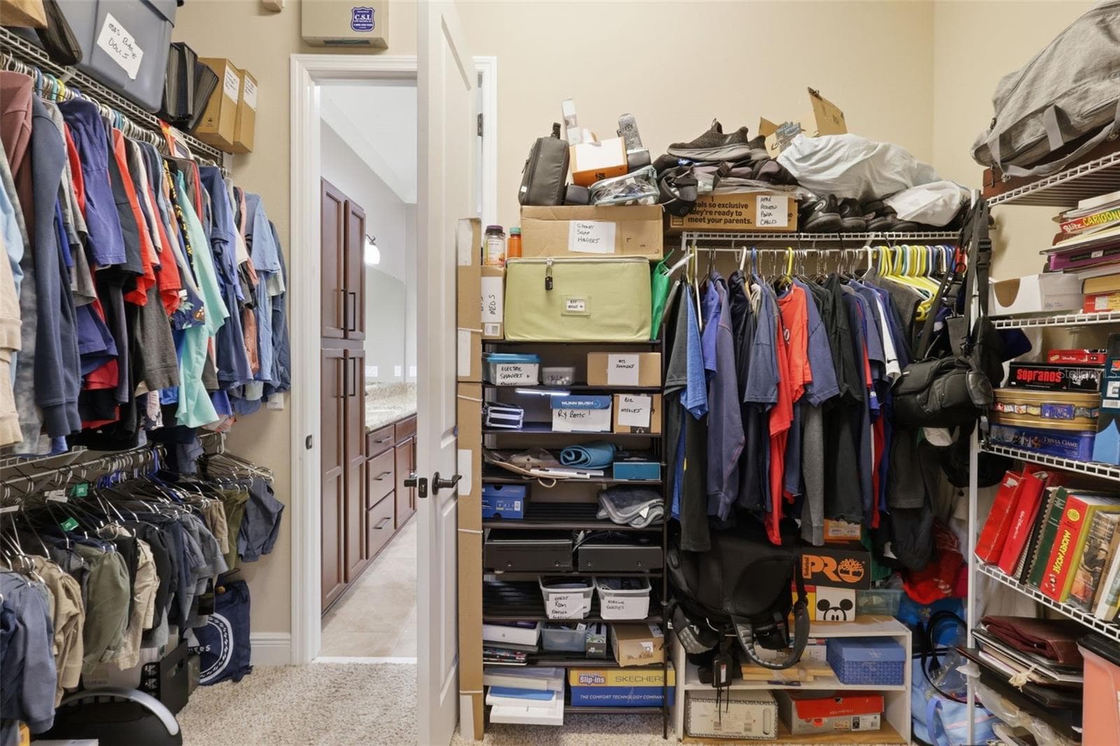 Primary Bedroom Closet with access to the laundry room. - 273 SILVER MAPLE RD, GROVELAND