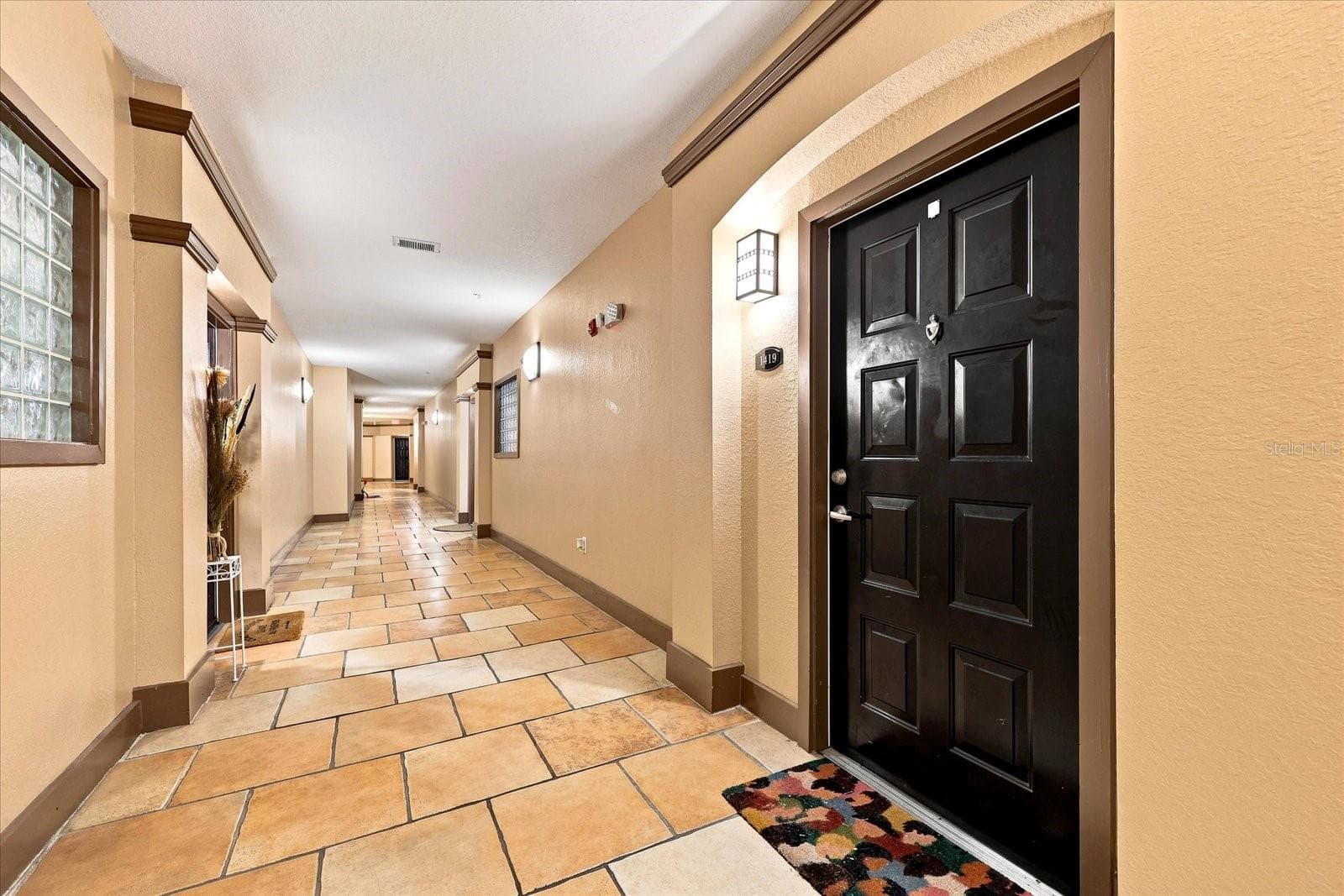 Air-Conditioned Hallway and entry door to #1419 - 4221 W SPRUCE ST #1419, TAMPA