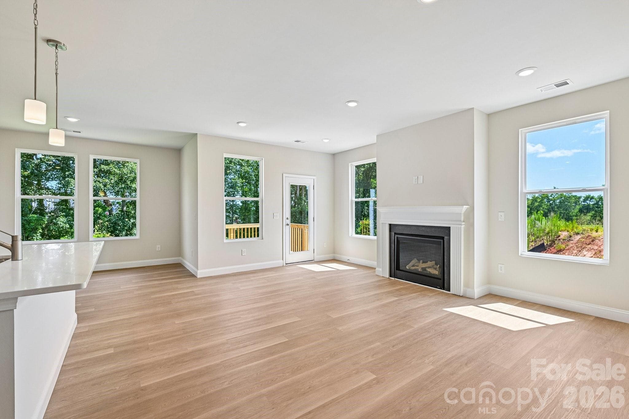 Looking into the main level great room from the front entry hallway - 605 Banter Lane, Gastonia