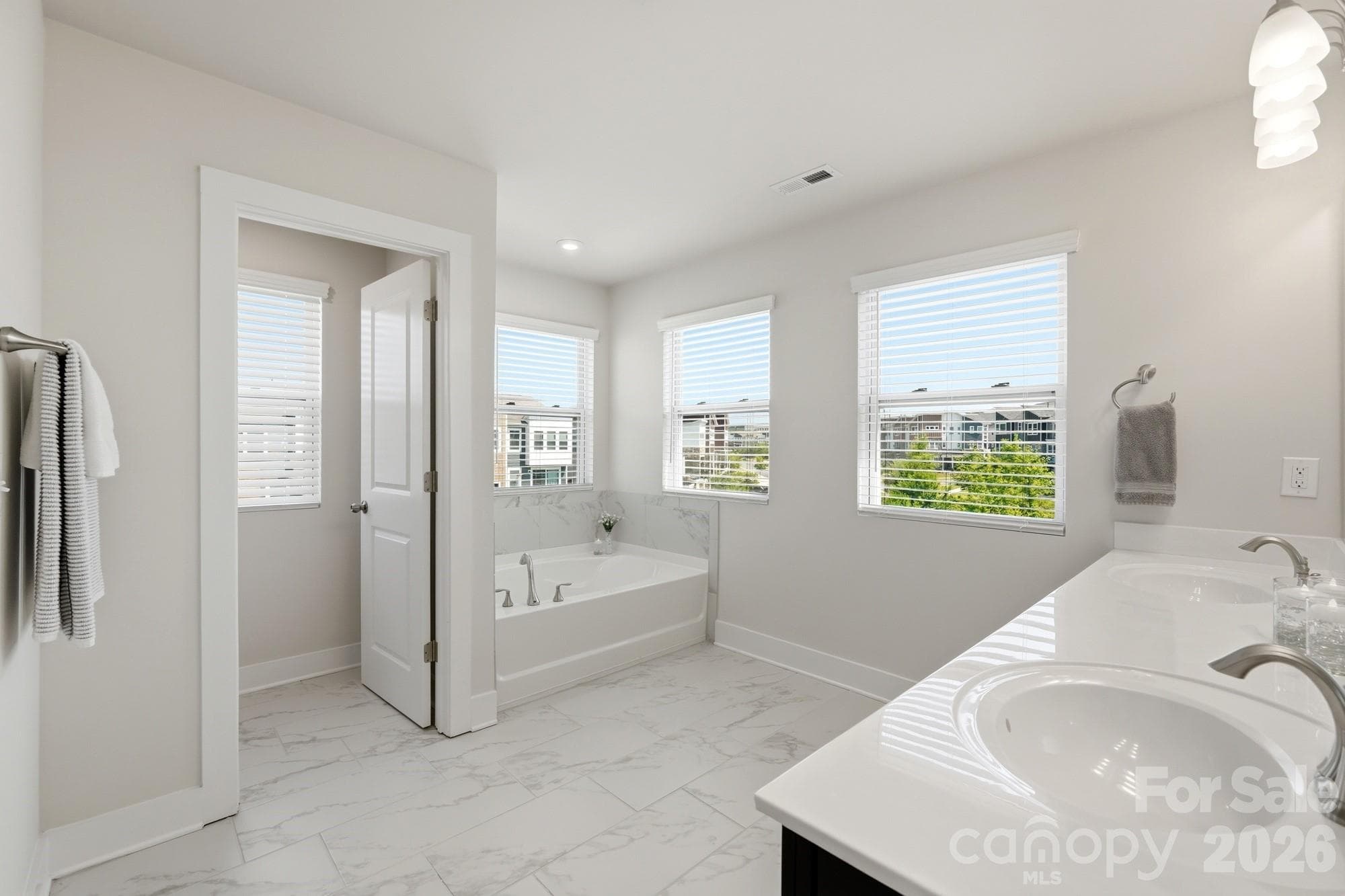 Lots of windows in the Primary Bath - 2745 Ensemble Court, Charlotte