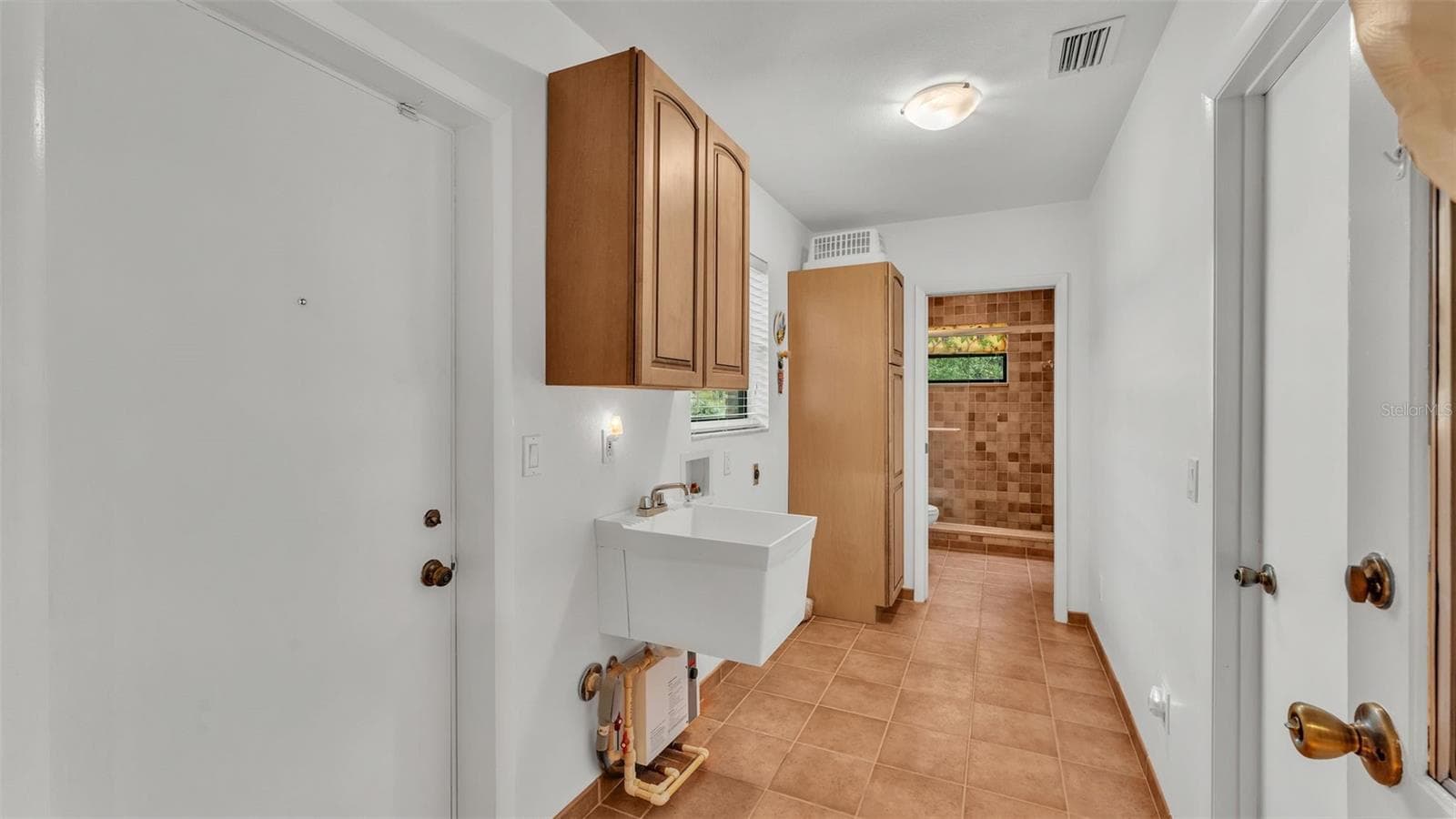 Rear Door Access to Garage / Laundry and Bath #2 - 9240 MOORE RD, LAKELAND