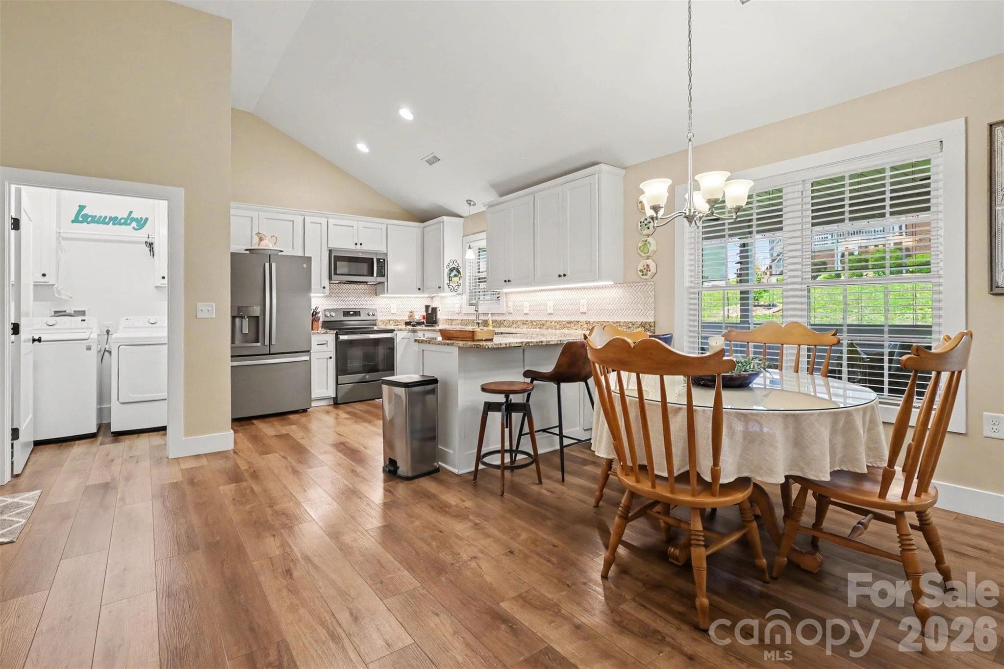 dining and kitchen island - 105 Kingston Place, Spindale