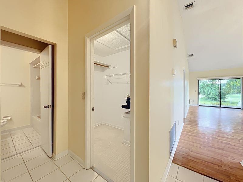 Foyer Showing Guest Bath, Inside Storage & Golf Course View - 340 GOLFSIDE CV #340, LONGWOOD