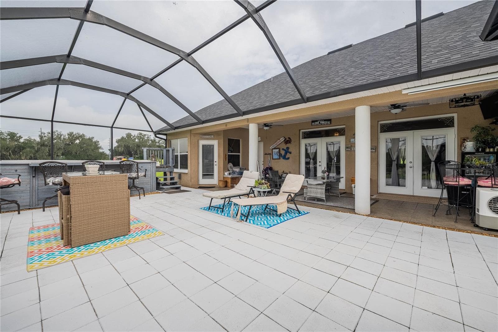 Lanai with plenty of seating space and 2 French doors to the Family Room - 4280 TURNER RD, MULBERRY