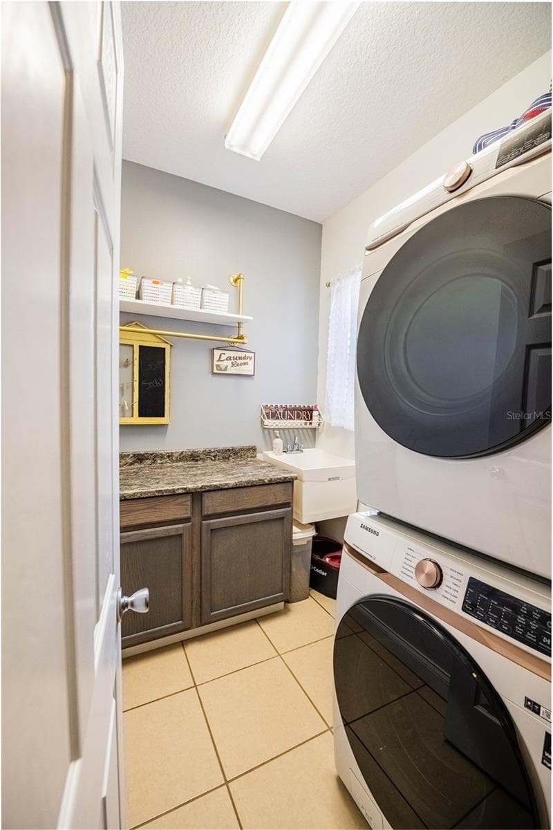 Laundry room with under cabinet storage - 4280 TURNER RD, MULBERRY