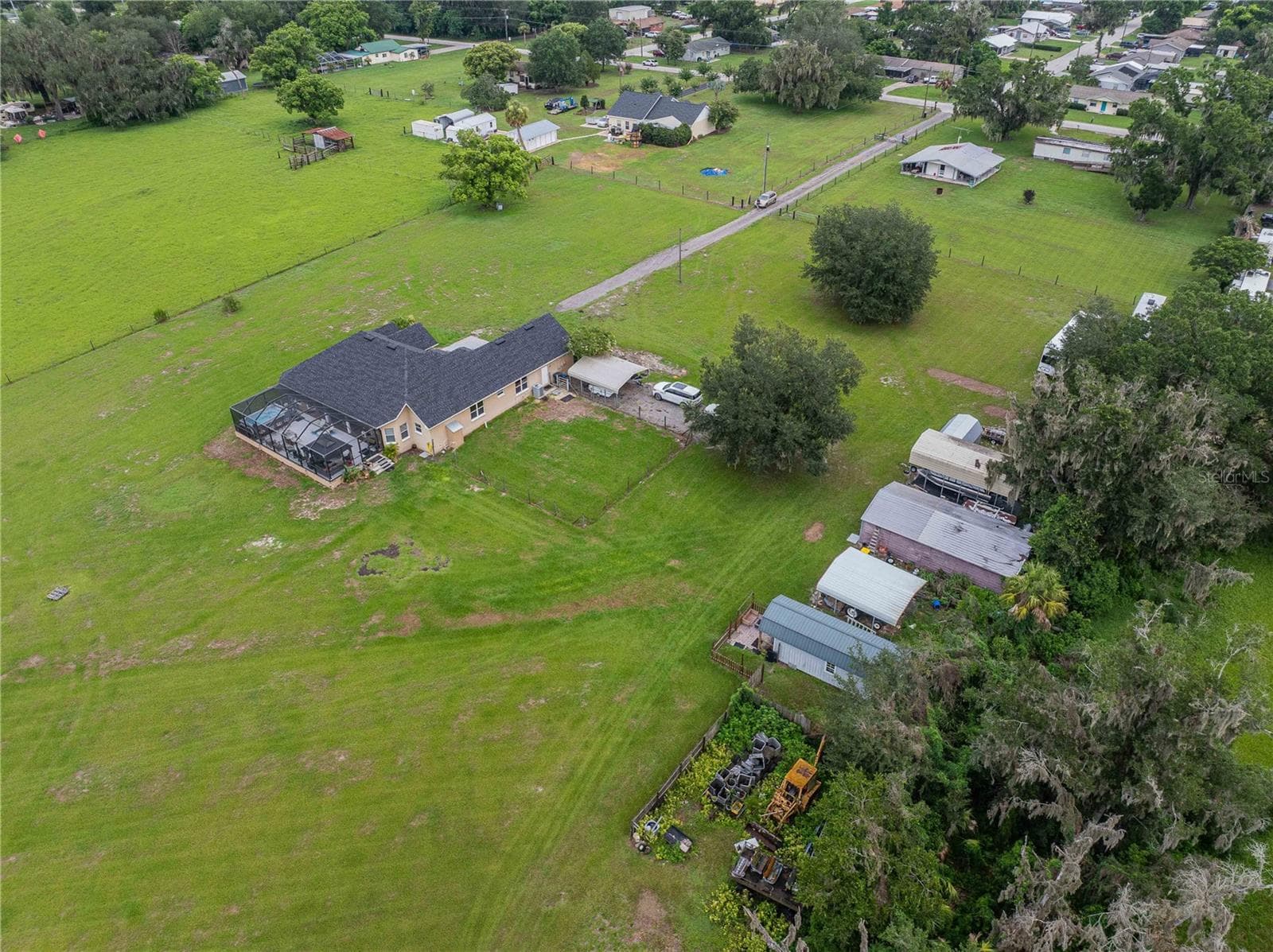Ariel view shows the long driveway, tiny house, 2 car carport, workshop, RV carport and shed to the right - 4280 TURNER RD, MULBERRY