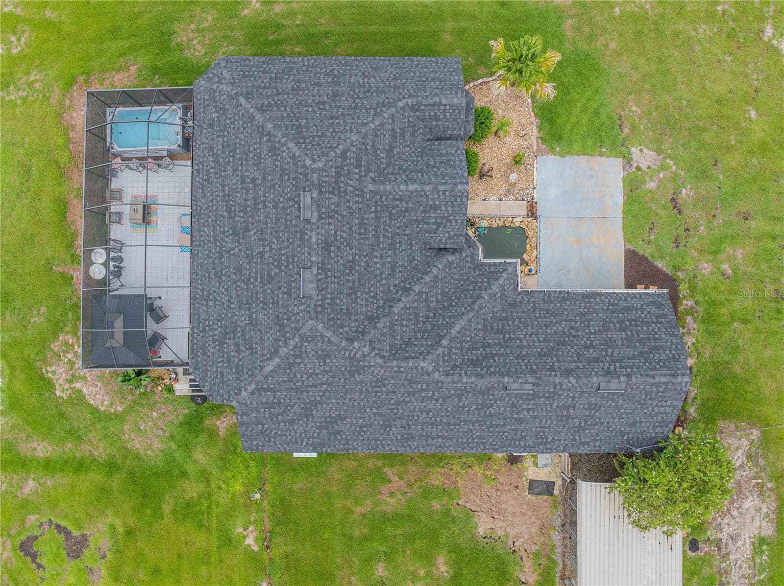 Aerial view of home shows the Lanai, front entrance and 2 car carport off the garage - 4280 TURNER RD, MULBERRY