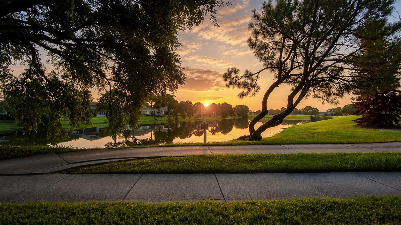 View from from Country Club Blvd at sunrise - 8027 SAINT ANDREWS WAY, MOUNT DORA