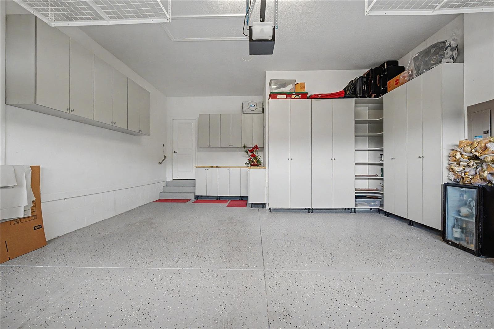 Garage with LOADS of storage cabinets and newly painted garage floor - 4926 SOUTHERN VALLEY LOOP, BROOKSVILLE