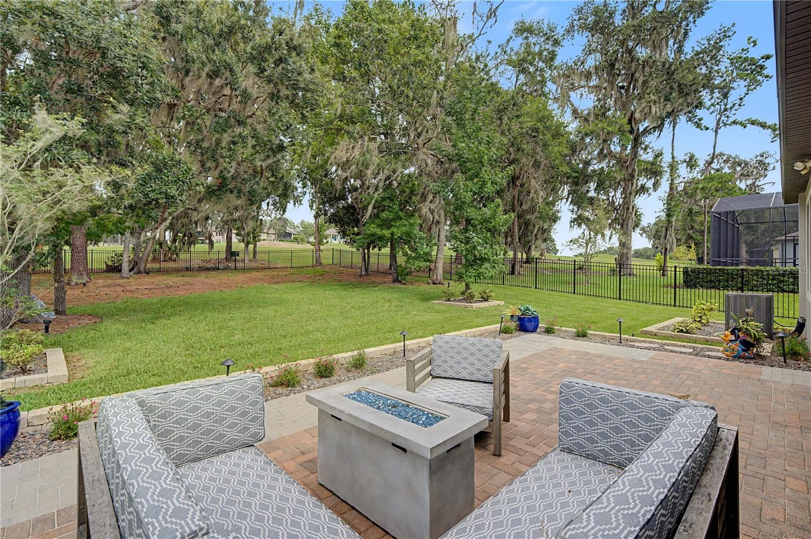 OPEN back patio overlooking fenced yard and golf course - 4926 SOUTHERN VALLEY LOOP, BROOKSVILLE