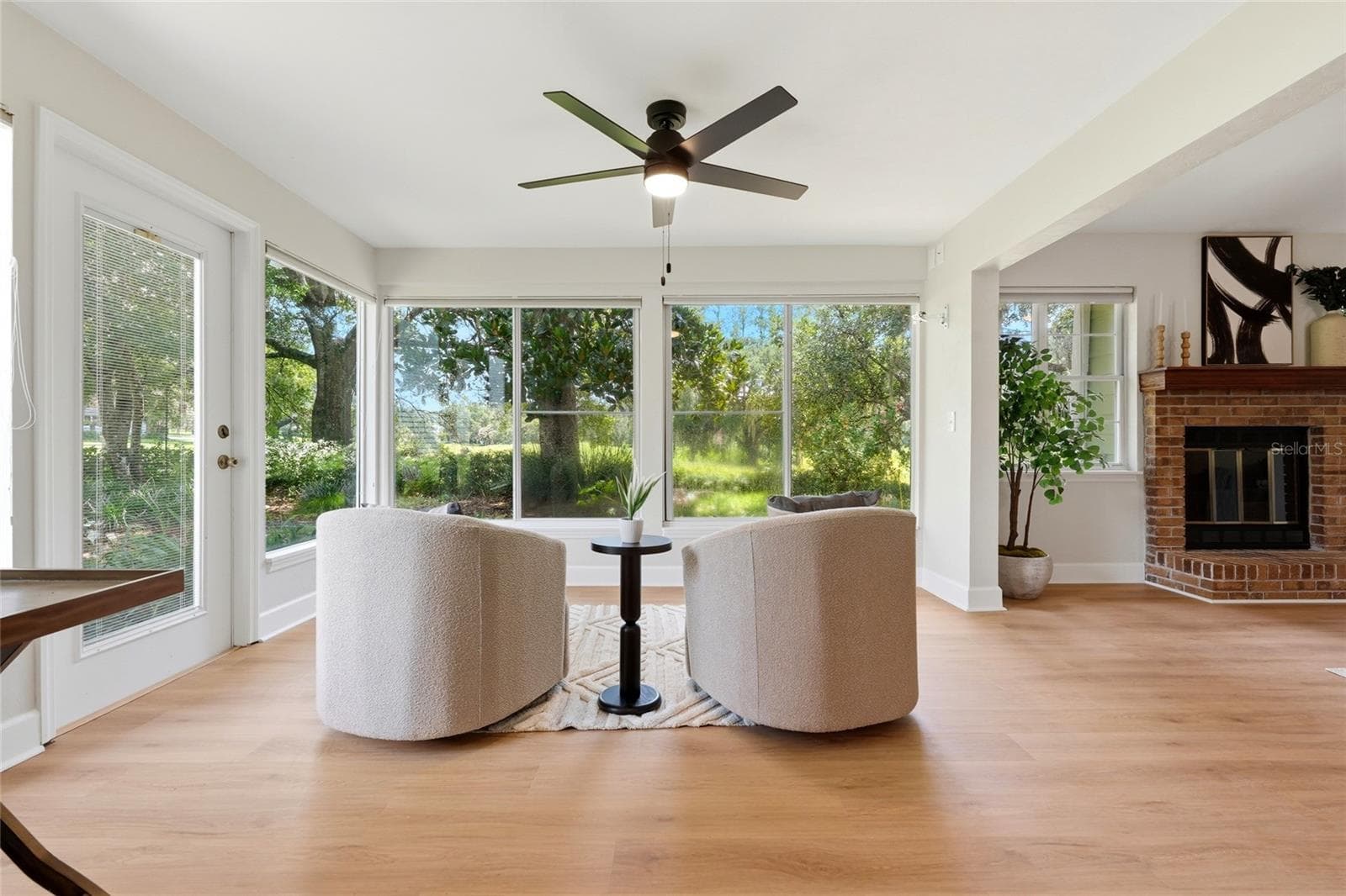 Enclosed porch off of the kitchen and living room - 10521 NW 36TH PL, GAINESVILLE