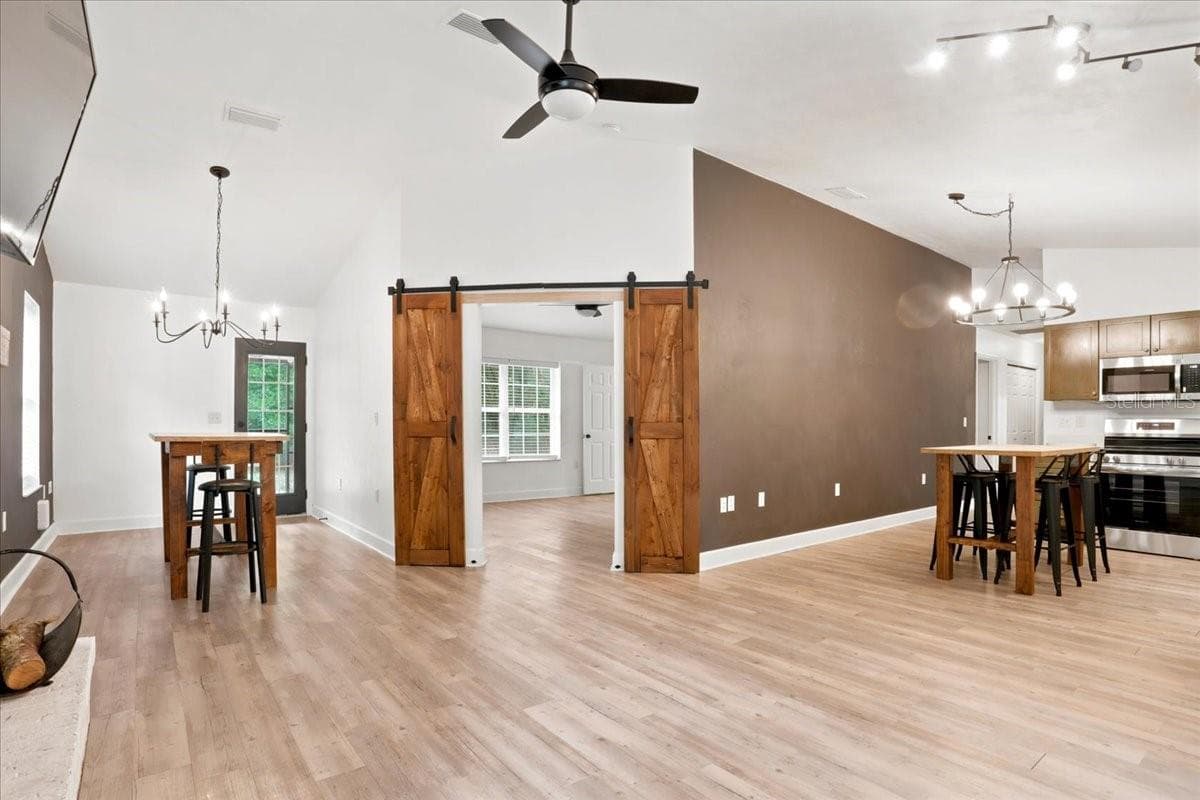 Barn style doors to primary bedroom - 5309 NE 60TH AVE, HIGH SPRINGS