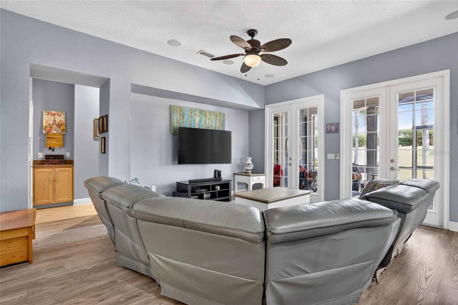 Large family room with french doors leading out to the screened lanai. - 416 MANNS HARBOR DR, APOLLO BEACH