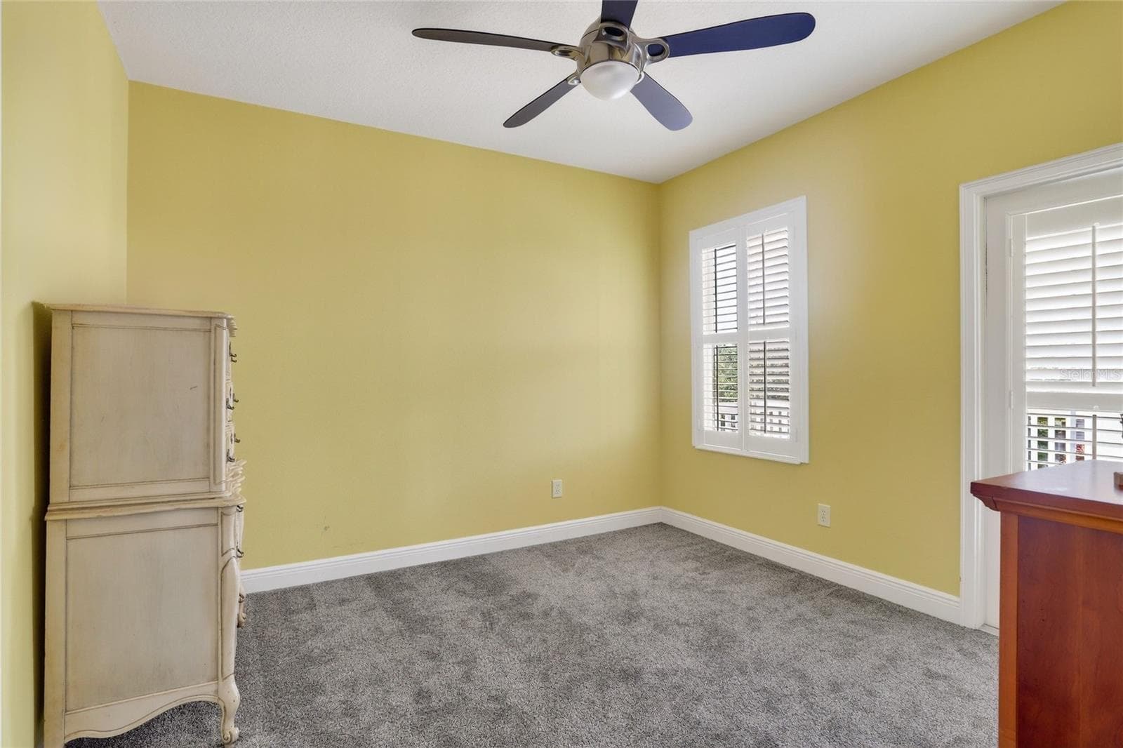 Guest bedroom 3 features a private balcony. - 416 MANNS HARBOR DR, APOLLO BEACH