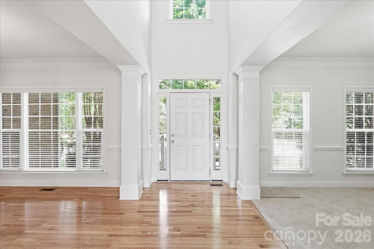Looking towards front door. Dining room on left, living room/flex space on right - 6055 Latta Springs Circle, Huntersville