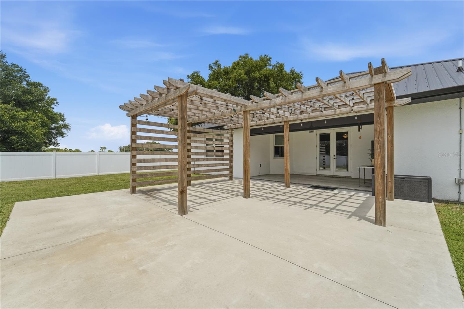 Pergola with power and concrete patio added. - 125 LONGWOOD DR, OSTEEN