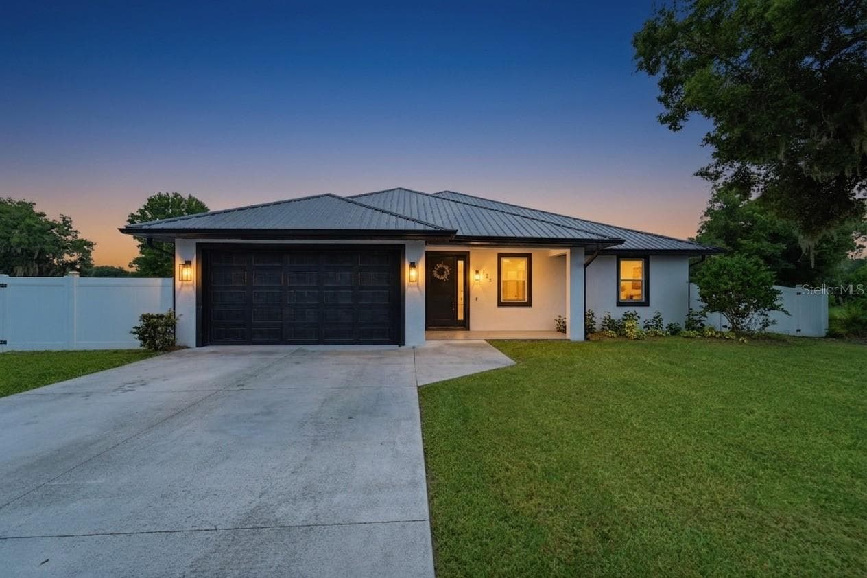 AI Generated twilight photography. Exterior front of home. - 125 LONGWOOD DR, OSTEEN