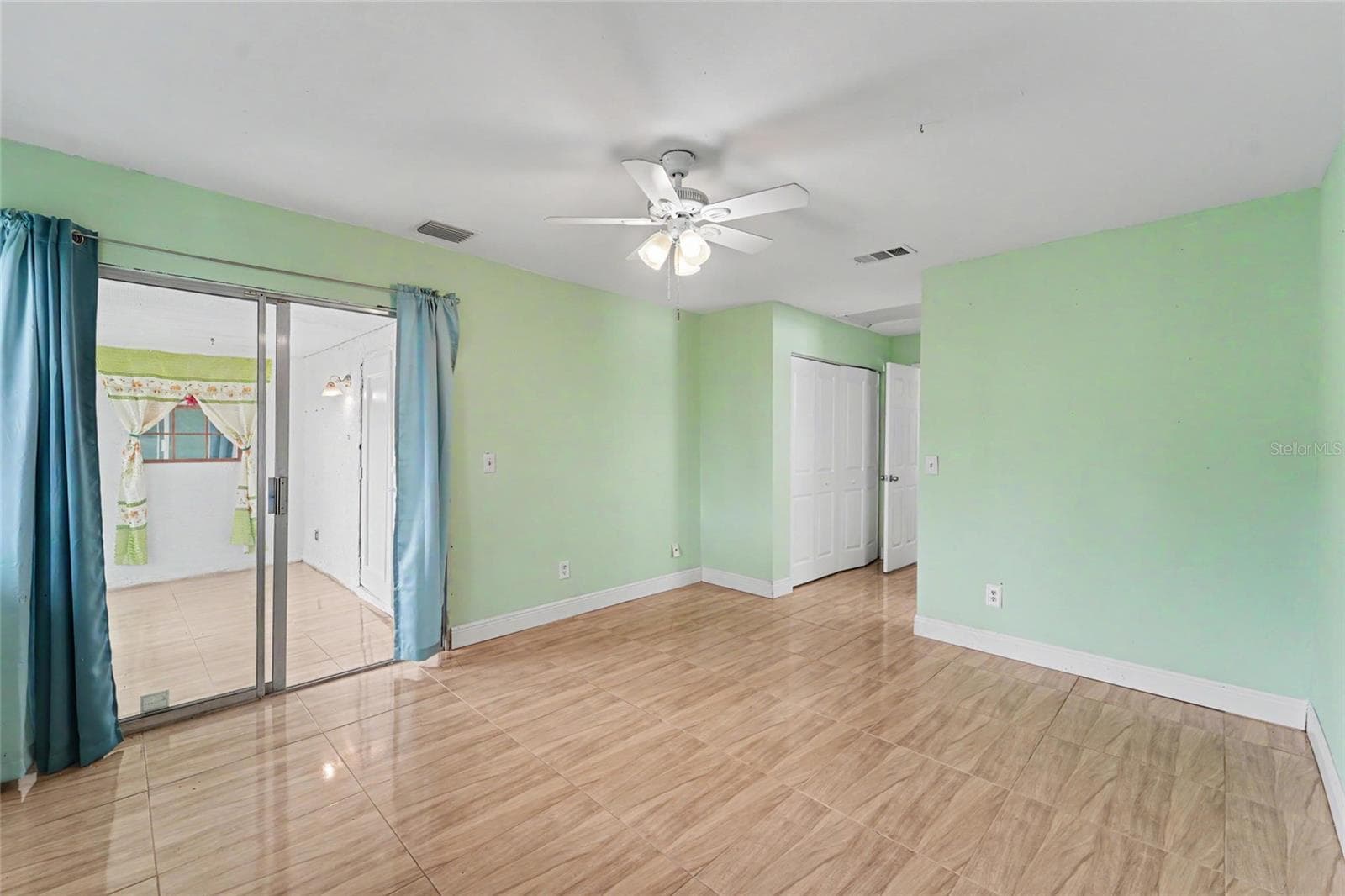 Primary Bedroom with entry to Sunroom - 3174 PHLOX DR, PALM HARBOR