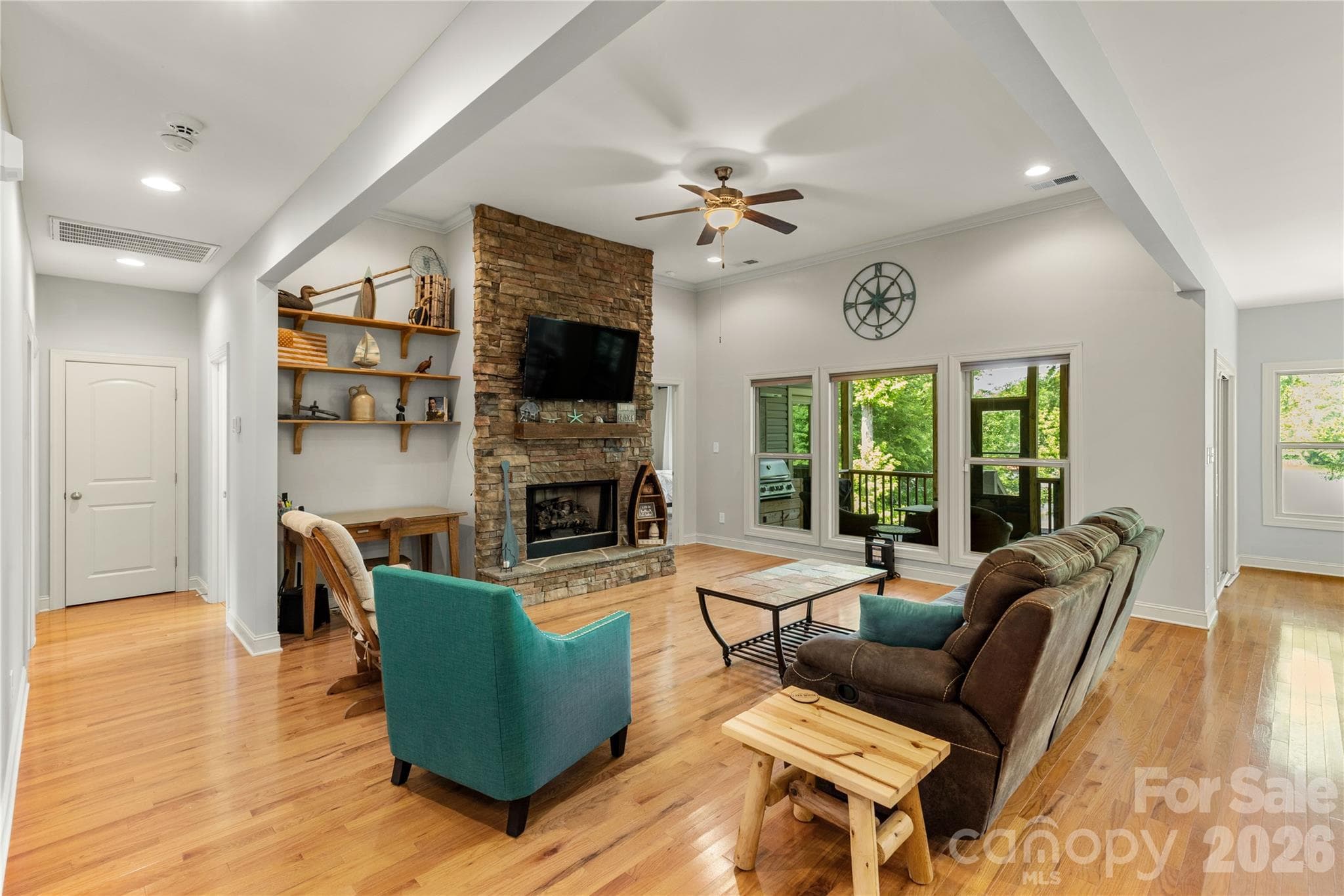 Living room with hardwood floors, and stone fireplace. - 2051 Great North Road, Winnsboro