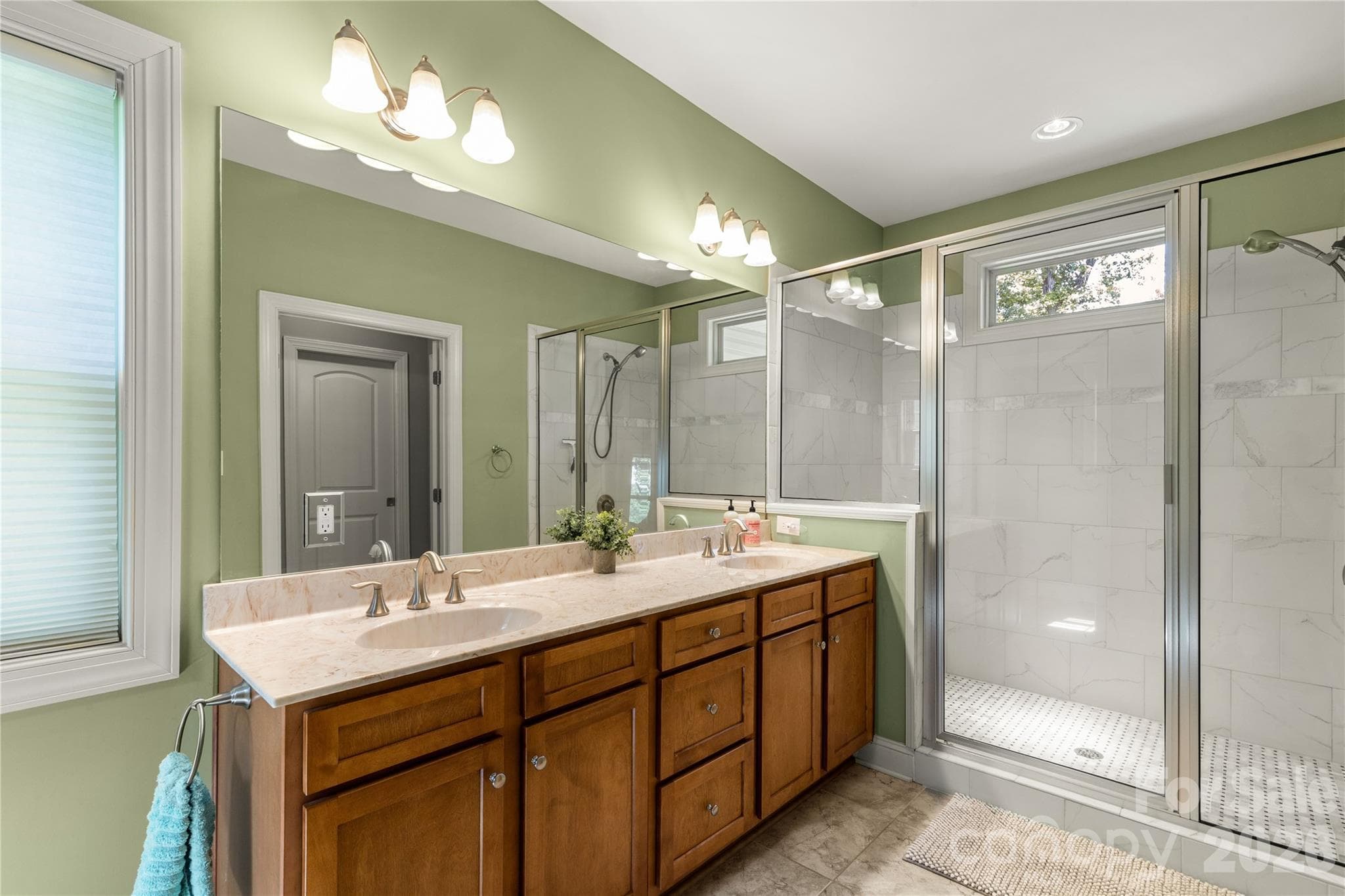 Primary bath with dbl sinks and walk in ceramic shower. - 2051 Great North Road, Winnsboro