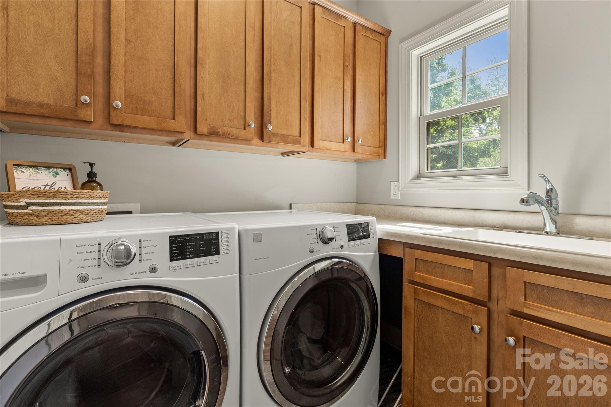 Laundry features cabinets and sink. - 2051 Great North Road, Winnsboro
