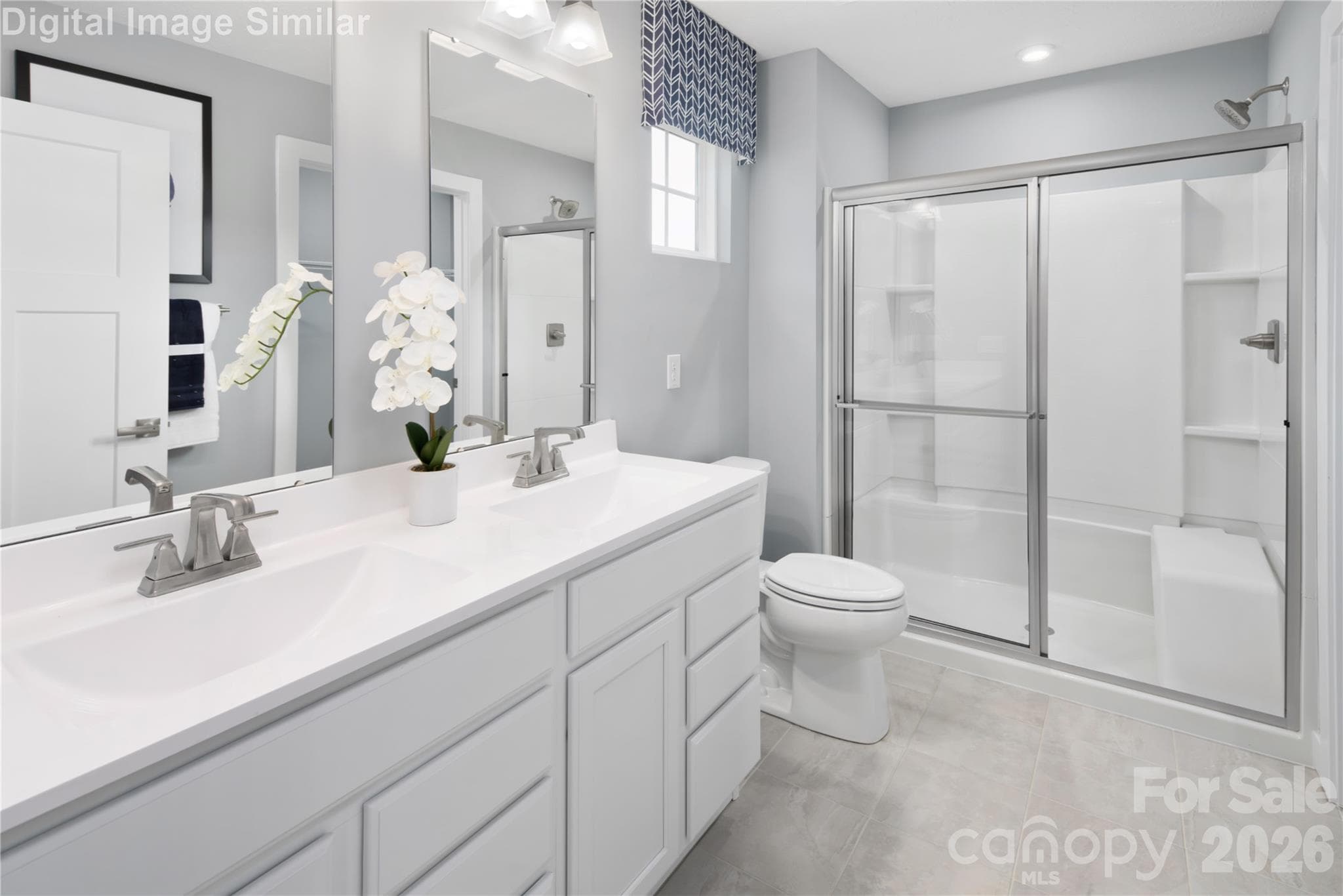 A beautifully appointed ensuite bathroom with a sleek framed shower door and polished, refined details throughout. - 333 Linwood Estates Drive, Lexington