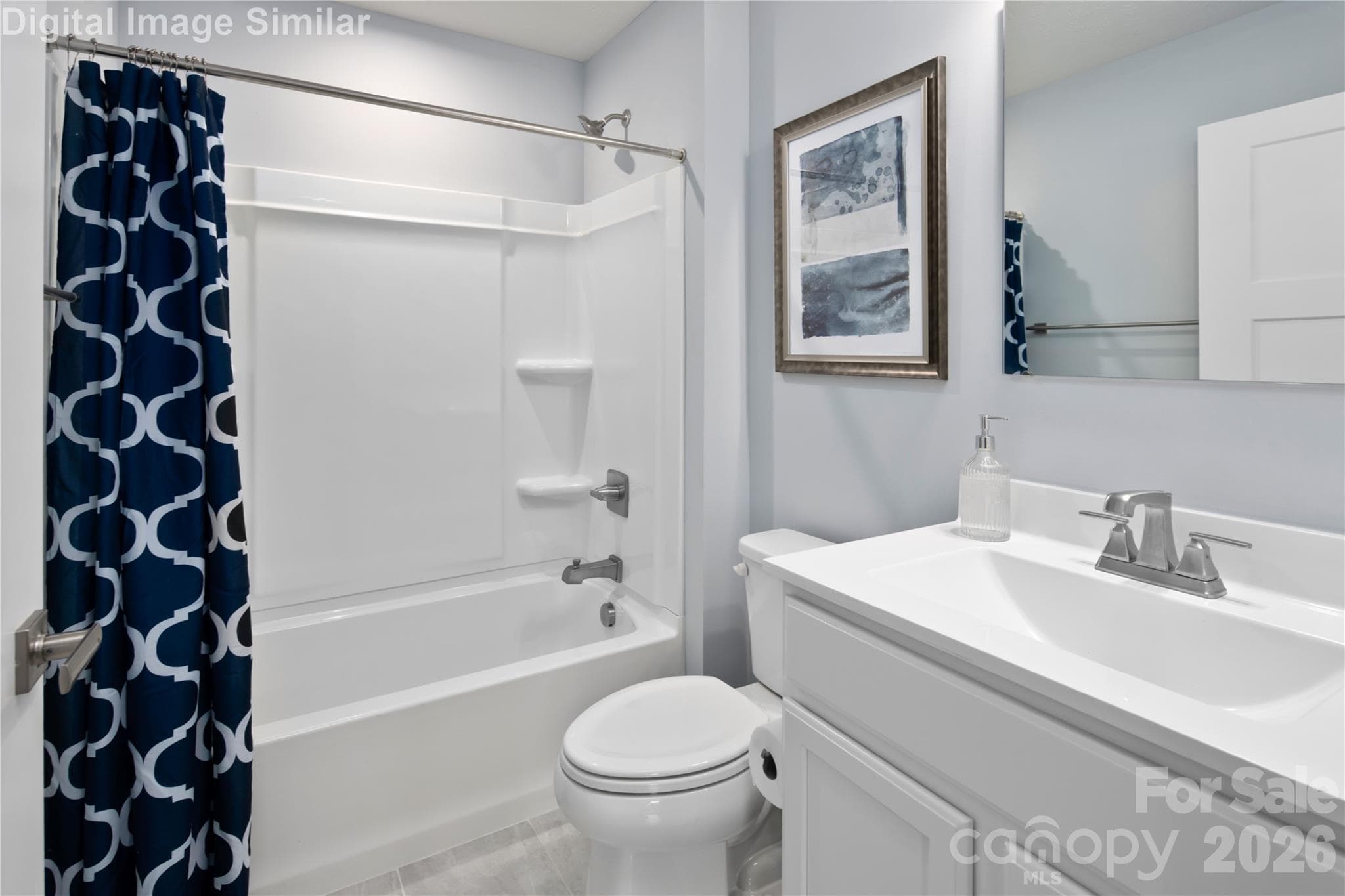Bright and well-appointed guest bath shared between bedrooms—stylish, fresh, and functional. - 333 Linwood Estates Drive, Lexington